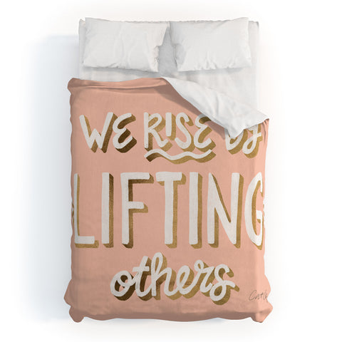 Cat Coquillette We Rise By Lifting Others Blush and Gold Duvet Cover